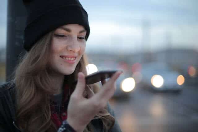 Woman using voice technology on her cellphone